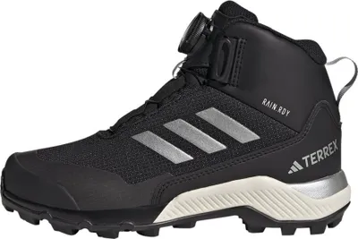 A side view of a black Adidas Terrex winter hiking boot with silver accents.