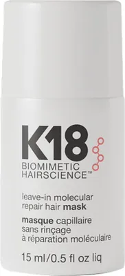 A white bottle of K18 Leave-In Molecular Repair Hair Mask.