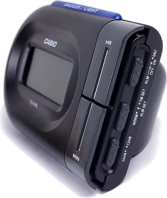 A black Casio alarm clock is shown against a white background.