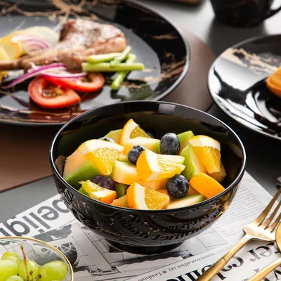 Immagine prodotto di Set di 16 pezzi - Nero con decorazioni dorate - Include: 4 tazze, 4 ciotole, 4 piatti grandi, 4 piatti piccoli