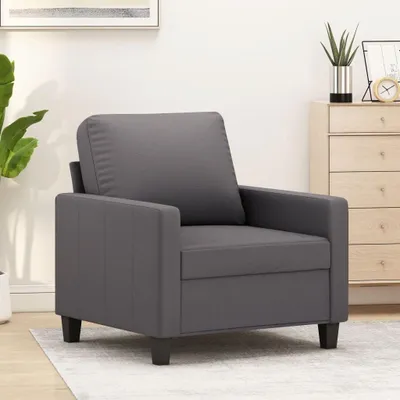 Zdjęcie produktu dla Nowoczesne, szare fotele, o wysokości 60 cm, wykonane z materiału przypominającego skórę, z metalową konstrukcją i grubym, wyściełanym siedziskiem, zapewniającym komfortowy wypoczynek. Materiał jest odporny na zabrudzenia i łatwy do czyszczenia, a konstrukcja jest solidna