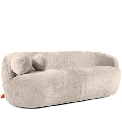 A modern, beige sofa with two round decorative pillows.