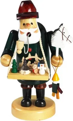 Räuchermännchen Spielzeughändler ist in Grün gekleidet und trägt eine rote Mütze. Er raucht Pfeife.