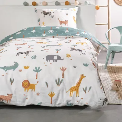 A close-up view of a children's duvet cover and pillowcase set with an African safari animal print.