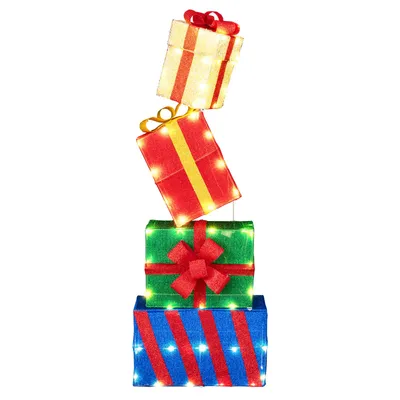 A stack of four illuminated gift boxes, designed as Christmas decorations.