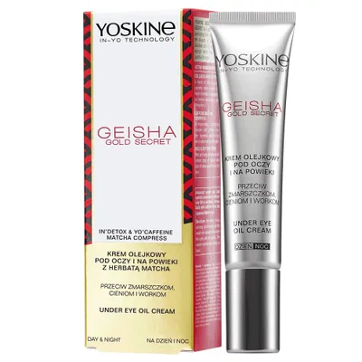 A product shot of a YOSKINE Geisha Gold Secret Under Eye Oil Cream tube and its packaging, presented against a white background.