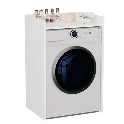 A white cabinet unit designed to house a washing machine, with decorative items on the top shelf.