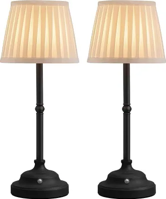 Two identical table lamps with pleated cream-colored shades and black bases are shown against a white background.