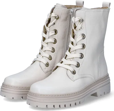 A pair of white lace-up boots on a white background.
