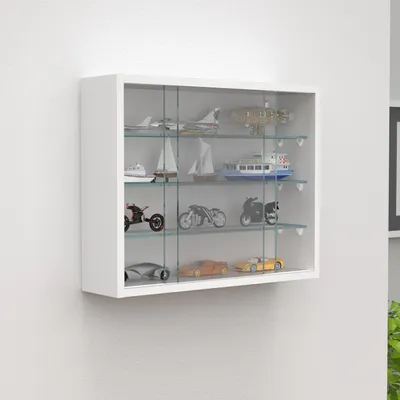 A white wall-mounted display cabinet filled with various miniature vehicles and boats.