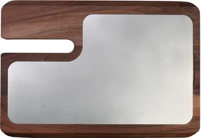 A cutting board with a metal insert.