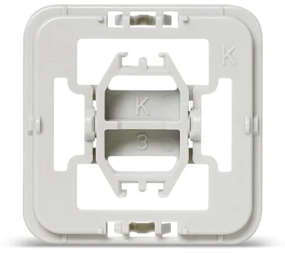 A close-up, studio shot of a white plastic electrical installation adapter, viewed from the front.