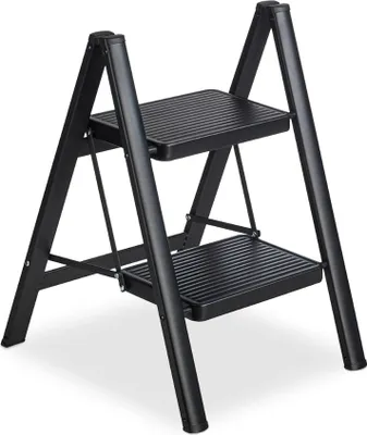 A black two-step folding ladder is shown against a white background.