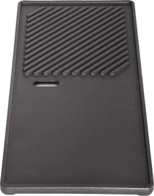 A cast iron grill plate with a ribbed section and a flat section, shown from a top-down perspective.