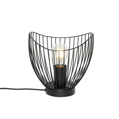 A black metal wire table lamp with a clear light bulb inside, set against a white background.