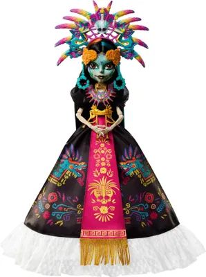 A doll dressed in a traditional Mexican-inspired outfit, standing against a white background.