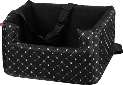 A black dog car seat with a white paw print pattern.