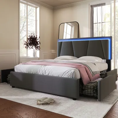 A bedroom scene featuring a modern bed with LED lighting.