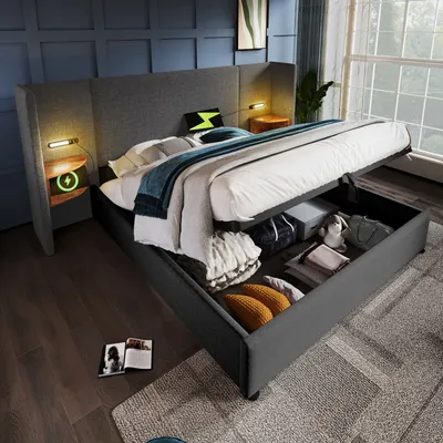 A modern bedroom with a hydraulic storage bed, showing the storage compartment open and filled with items.