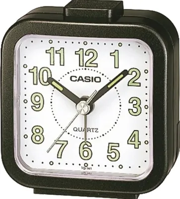 A close-up studio shot of a black Casio analog alarm clock with a white face.
