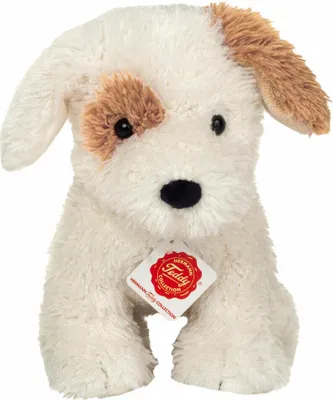 A plush toy dog sitting on a white background with a tag attached.
