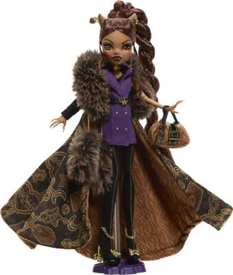 A Monster High doll standing on a display stand.