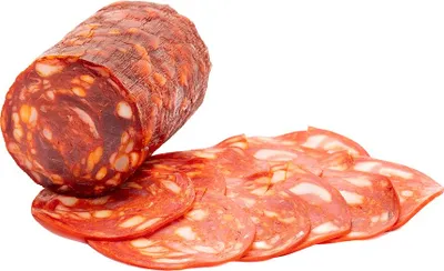 A sliced chorizo sausage on a white background.