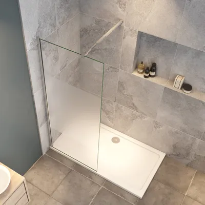 A modern bathroom shower enclosure with a frosted glass panel and a white shower tray.