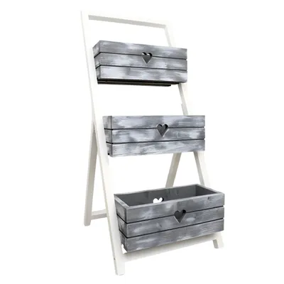 A three-tiered wooden planter stand with gray and white distressed finish.