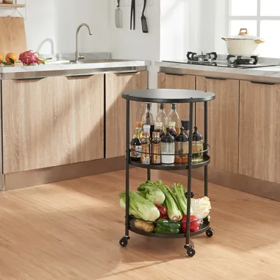 A kitchen scene with a rolling cart filled with vegetables and bottles of condiments.