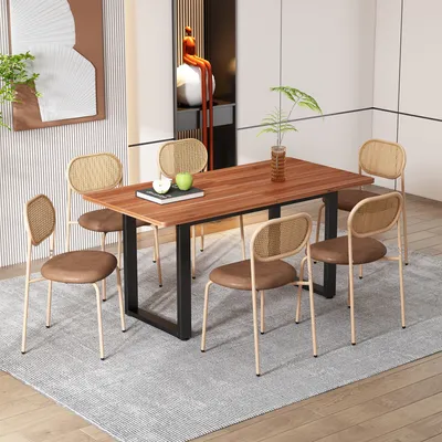 A dining room scene with a wooden table and six chairs.
