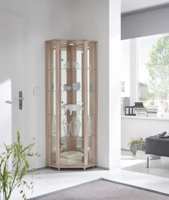 A corner display cabinet filled with decorative items in a room setting.