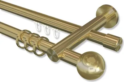 A close-up, angled view of a double curtain rod set with decorative finials and curtain rings.