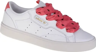 A white Adidas sneaker with pink ribbon laces.