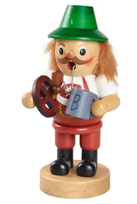 Räuchermännchen Bayer auf dem Oktoberfest in traditioneller bayerischer Tracht. Er trägt grünen Hut.