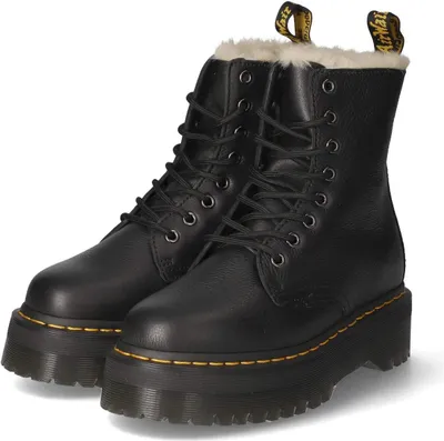 A pair of black Dr. Martens boots with a platform sole and faux fur lining, displayed on a white background.