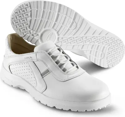 A pair of white Sika work shoes, with one shoe shown from the side and the sole of another shoe shown from above.