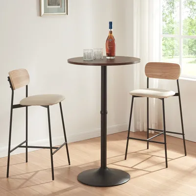 A bar table with two bar stools in a room with a window.