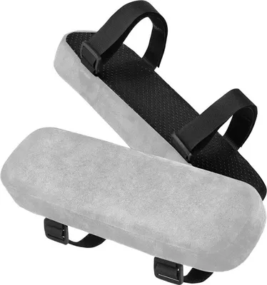 Two armrest pads for chairs, one on top of the other.