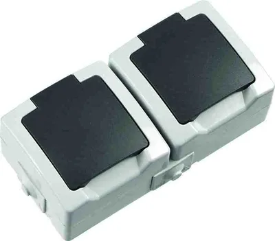 A close-up, studio shot of two connected electrical outlets with black covers.