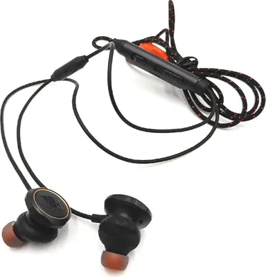 A pair of black in-ear headphones with an orange accent on the inline remote.