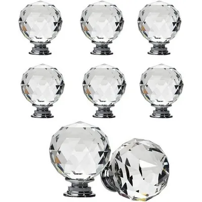 A collection of crystal cabinet knobs on a white background.