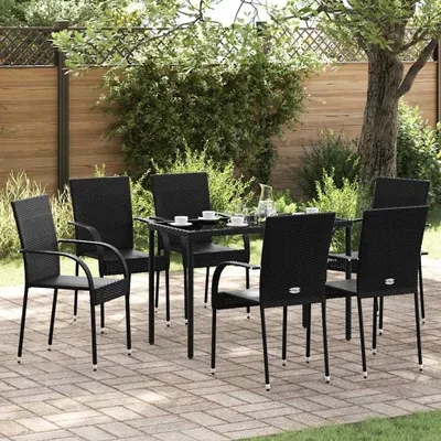 An outdoor patio setting with a table and chairs.