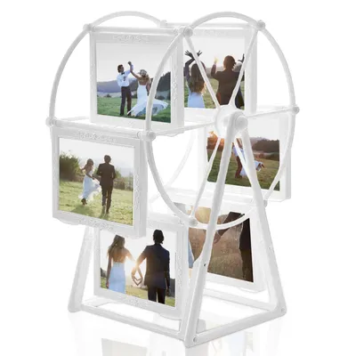 A white Ferris wheel photo frame with multiple wedding photos displayed.