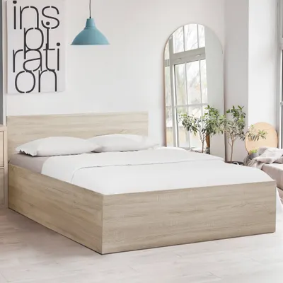 A bed in a room with a poster and a mirror.