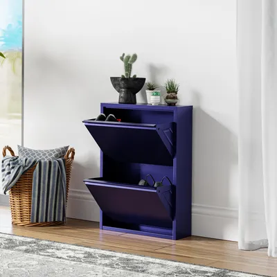 A dark blue shoe cabinet with two flip-down drawers is shown in a room setting.