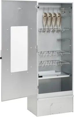 An open smoker oven with fish hanging inside.