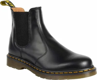 A black leather Chelsea boot is shown against a white background.