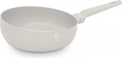 A cream-colored wok pan with a gray handle is shown against a white background.