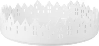 A white decorative bowl with a cut-out pattern of houses around the rim.